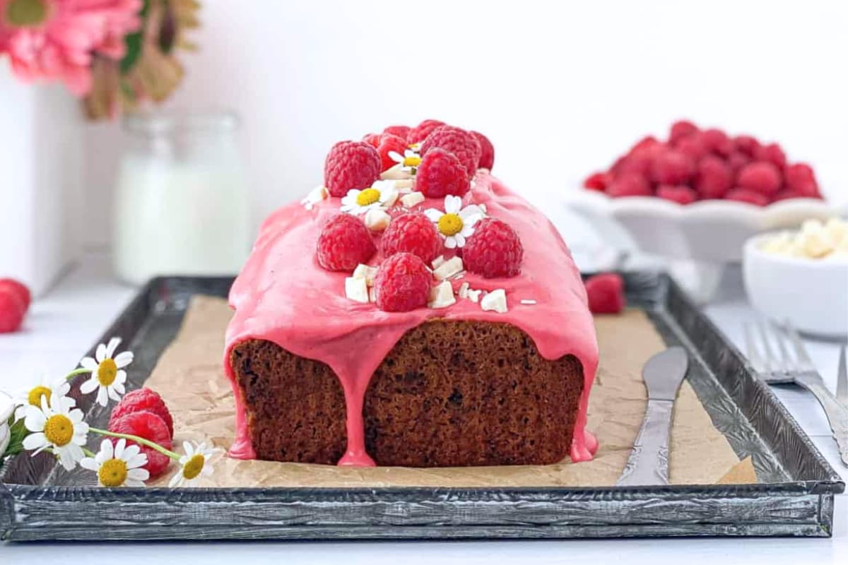 A plate of Raspberry White Chocolate Loaf Cake.