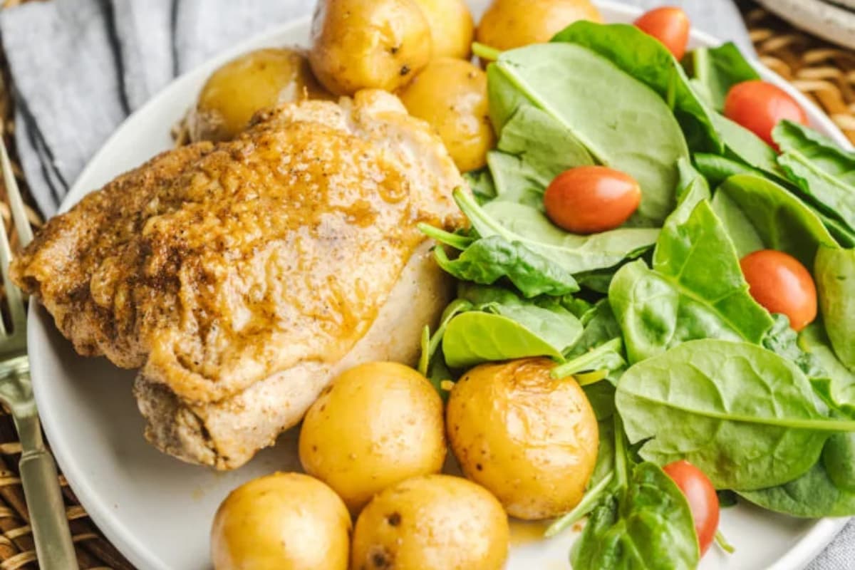 A plate of Crockpot Chicken and Potatoes.
