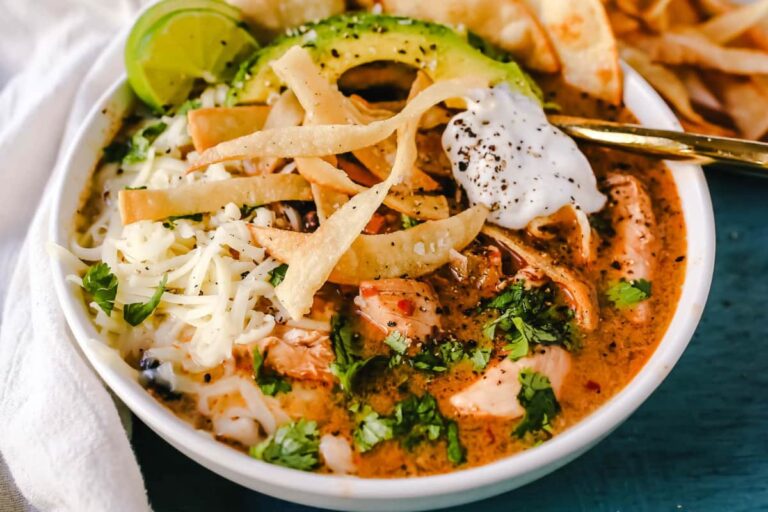 A bowl of Slow Cooker Creamy Chicken Tortilla Soup.