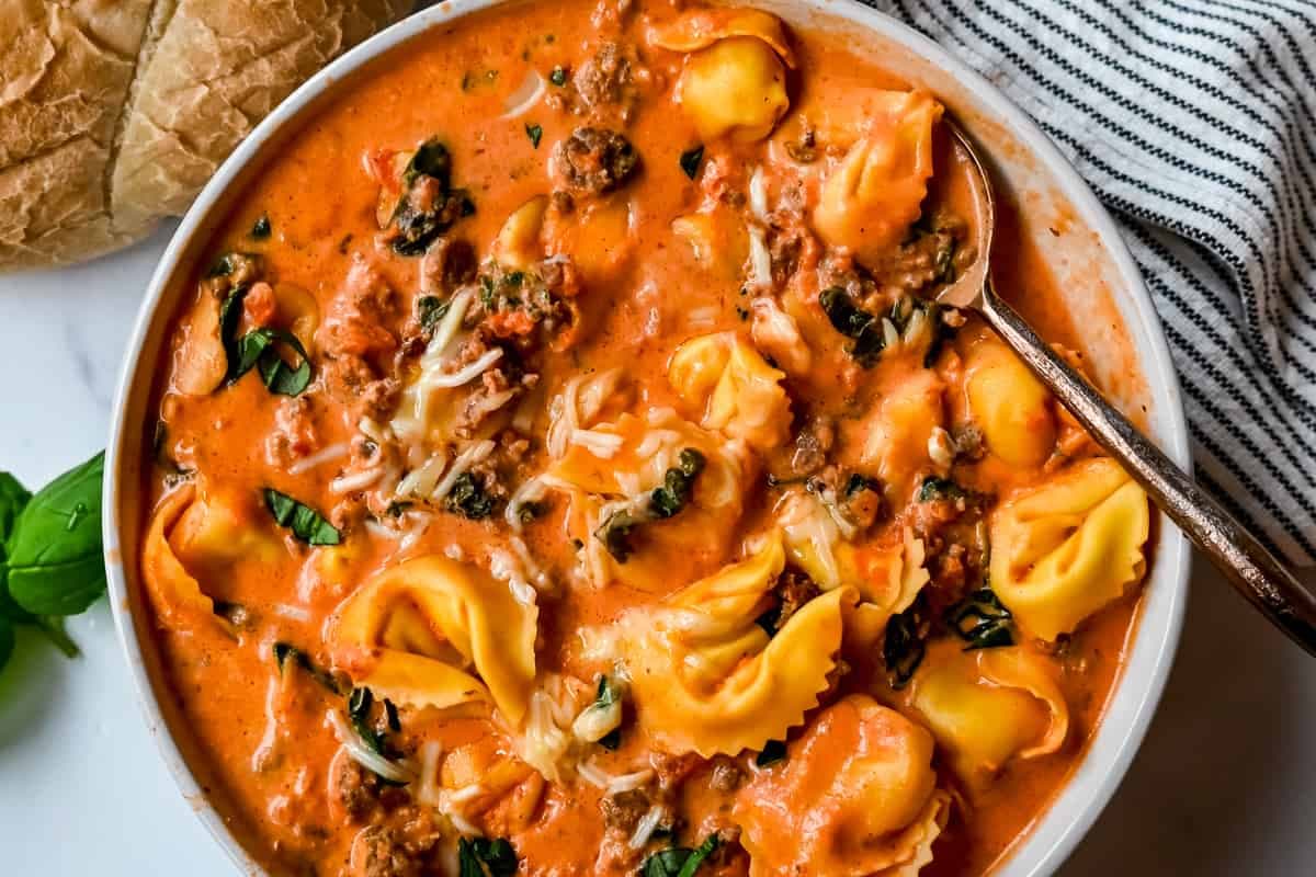 A bowl of Creamy Sausage Tortellini Soup.