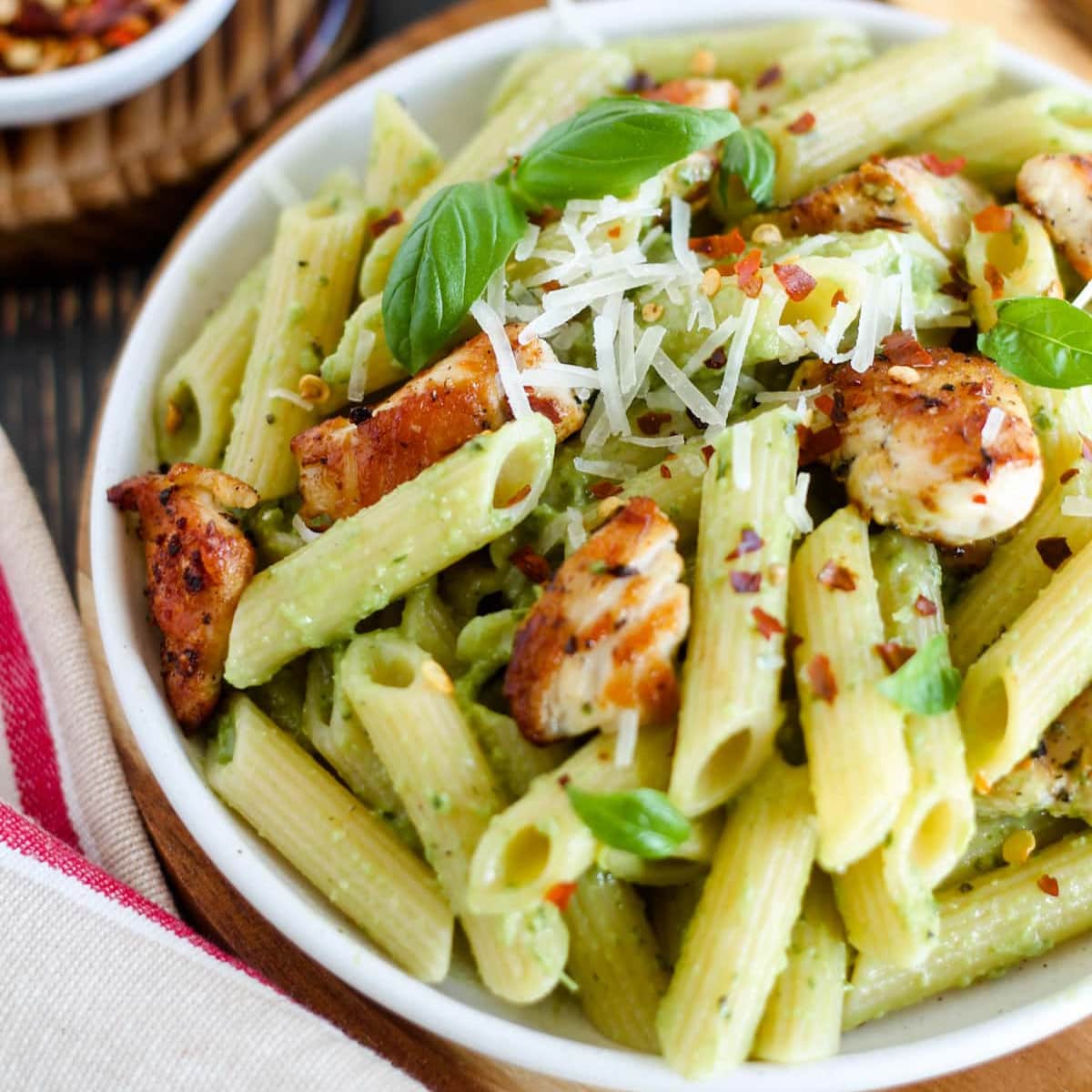 A plate of spicy basil chicken pasta.