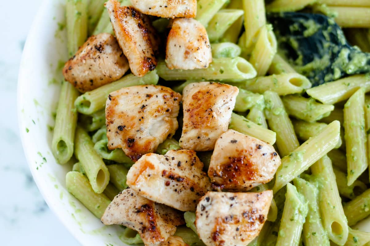 Chicken tossed with noodles and sauce.