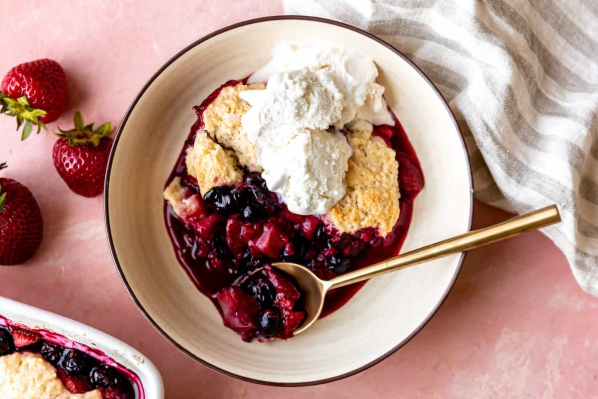 A dish of Strawberry, Blueberry and Raspberry Cobbler.