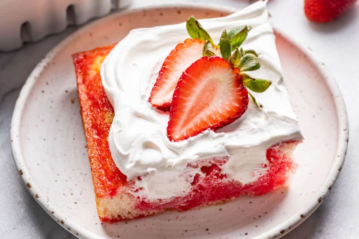 A plate of Strawberry Poke Cake.