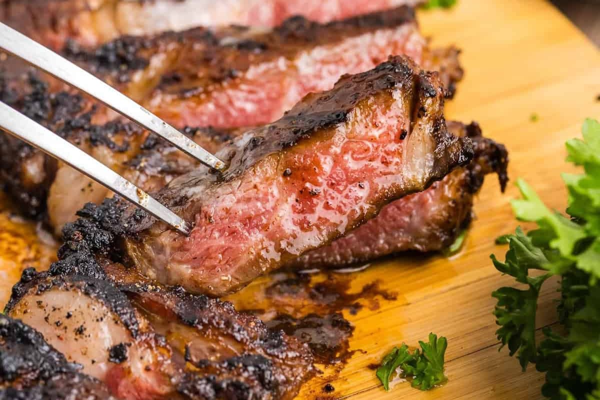 A plate of Coffee Rubbed Grilled Ribeye.