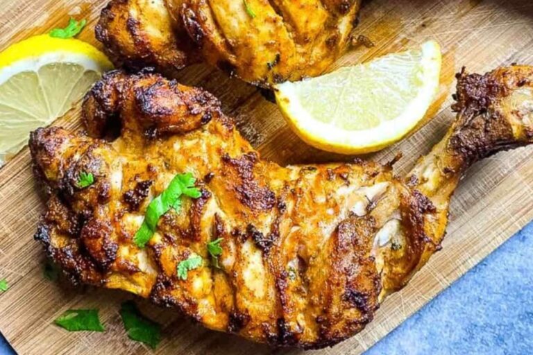 A plate of Air Fryer Chicken Leg Quarters.