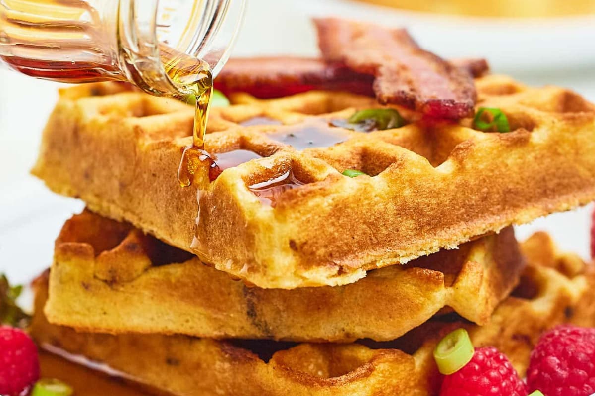 A plate of Cornmeal Maple Bacon Waffles.
