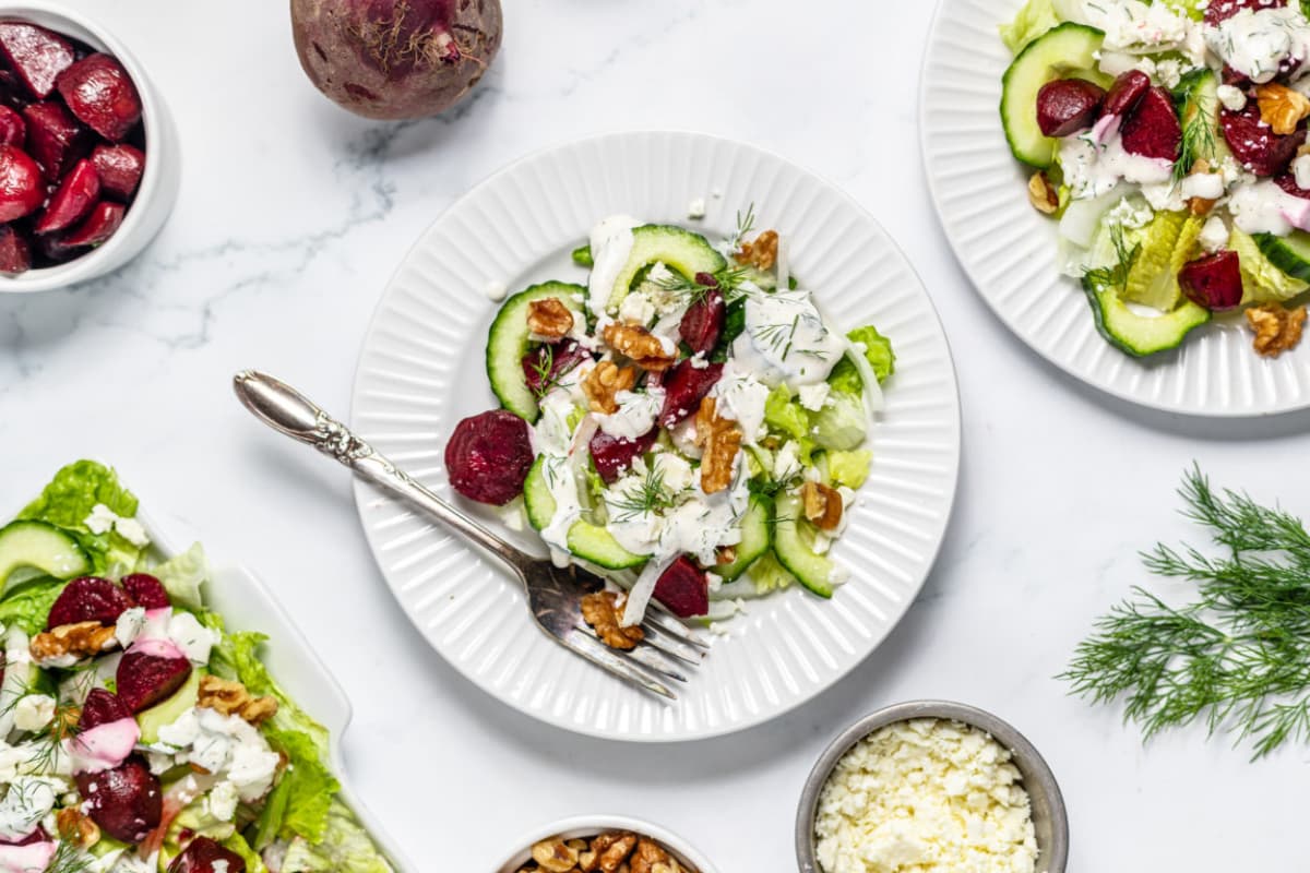 A plate of Beetroot Cucumber Salad with Creamy Dill Dressing.
