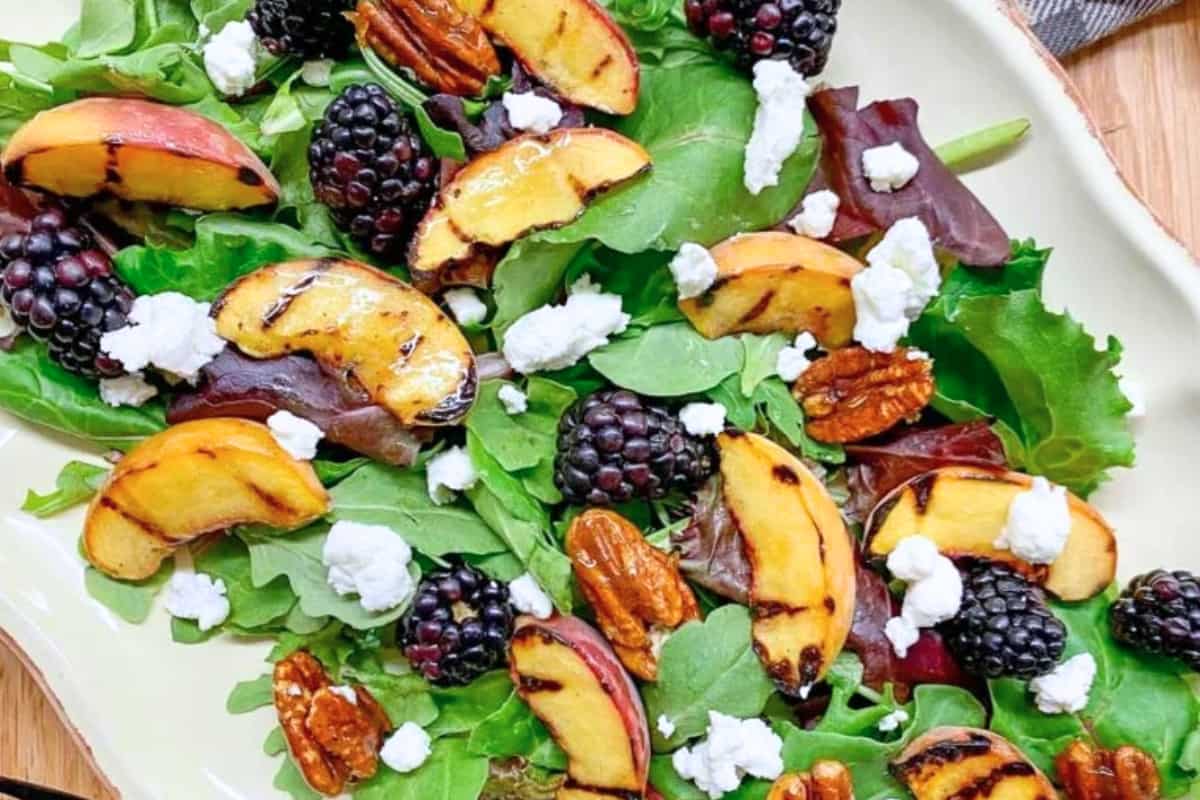 A plate of Grilled Peach Blackberry Salad.