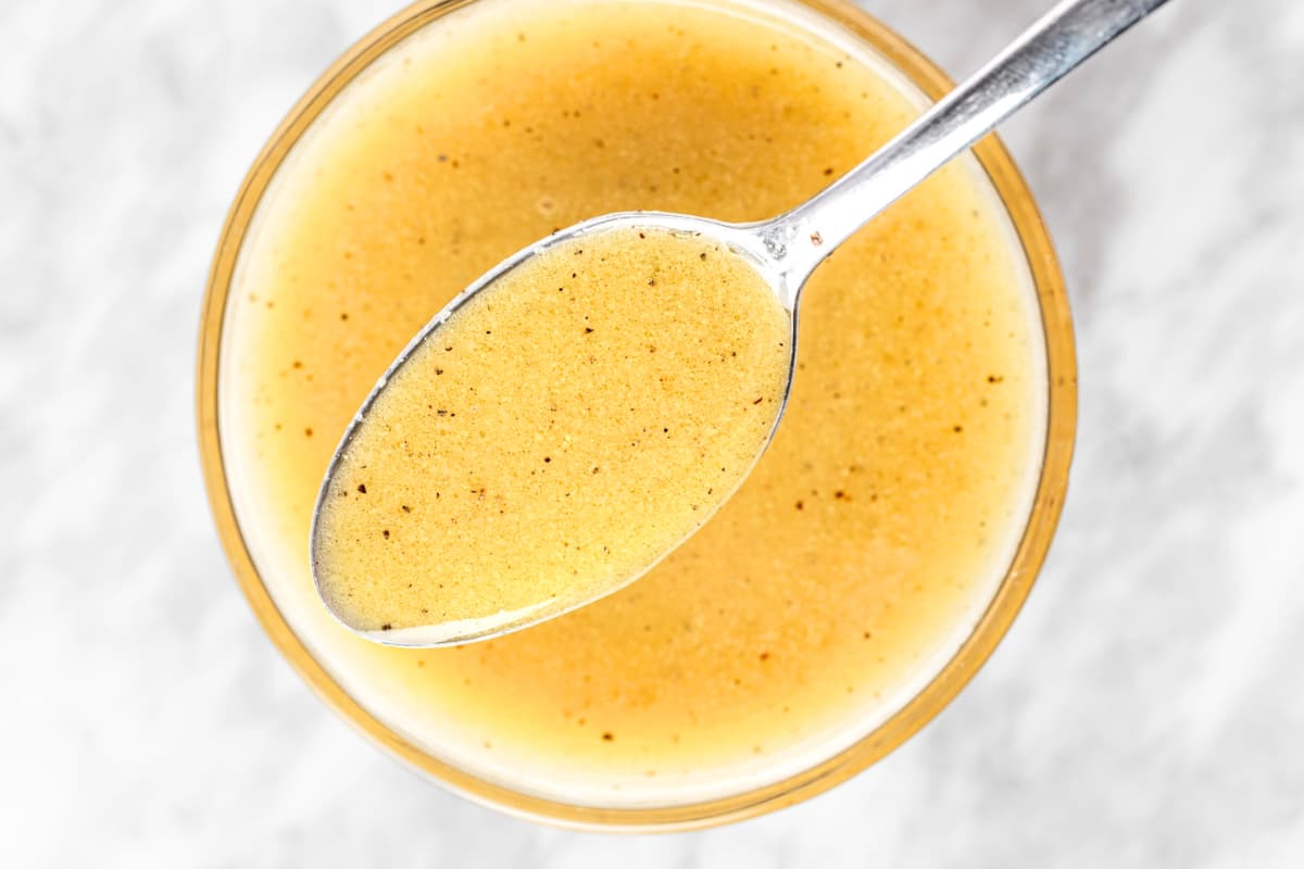 A dish of Apple Cider And Dijon Mustard Vinaigrette.