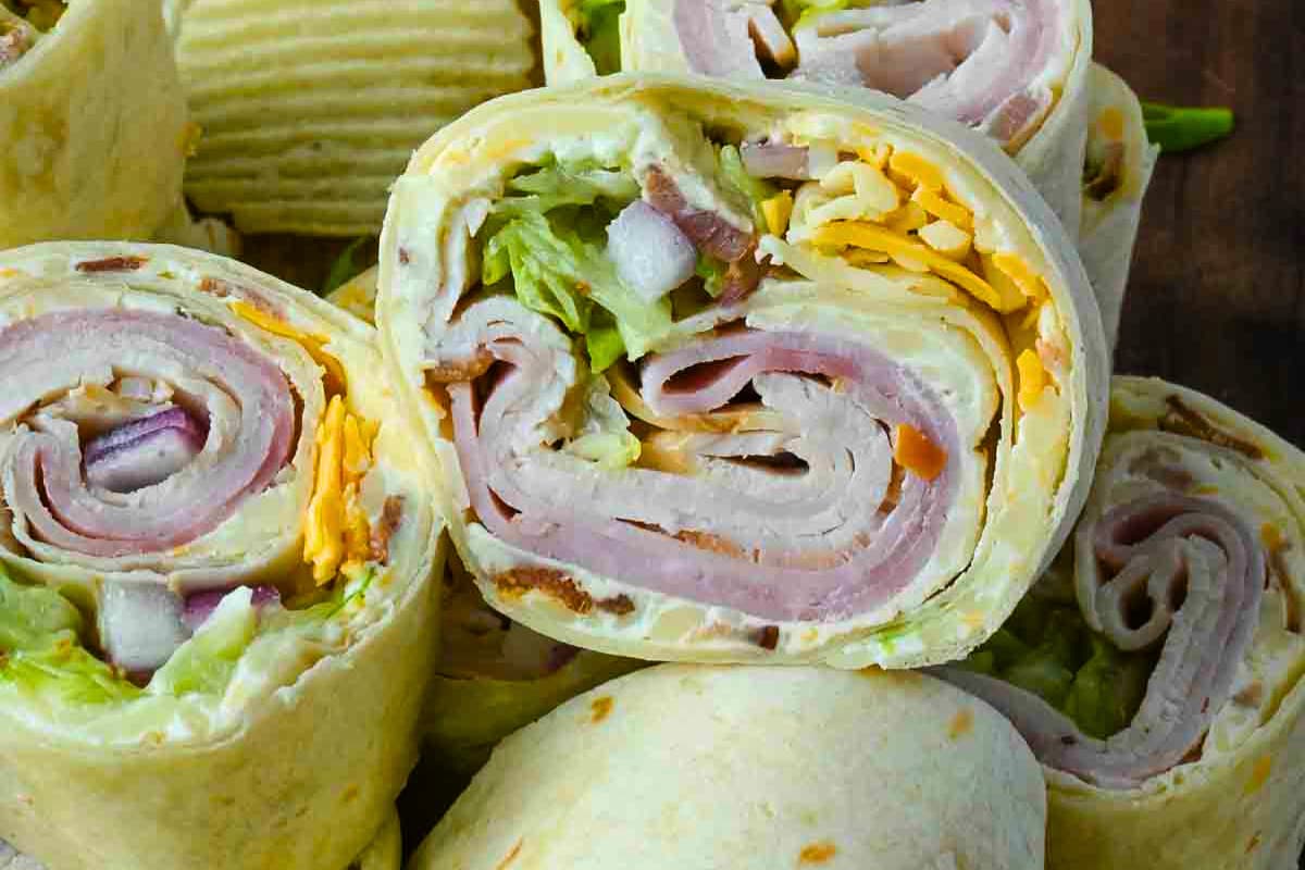 A tray of High Roller Pinwheel Sandwiches.