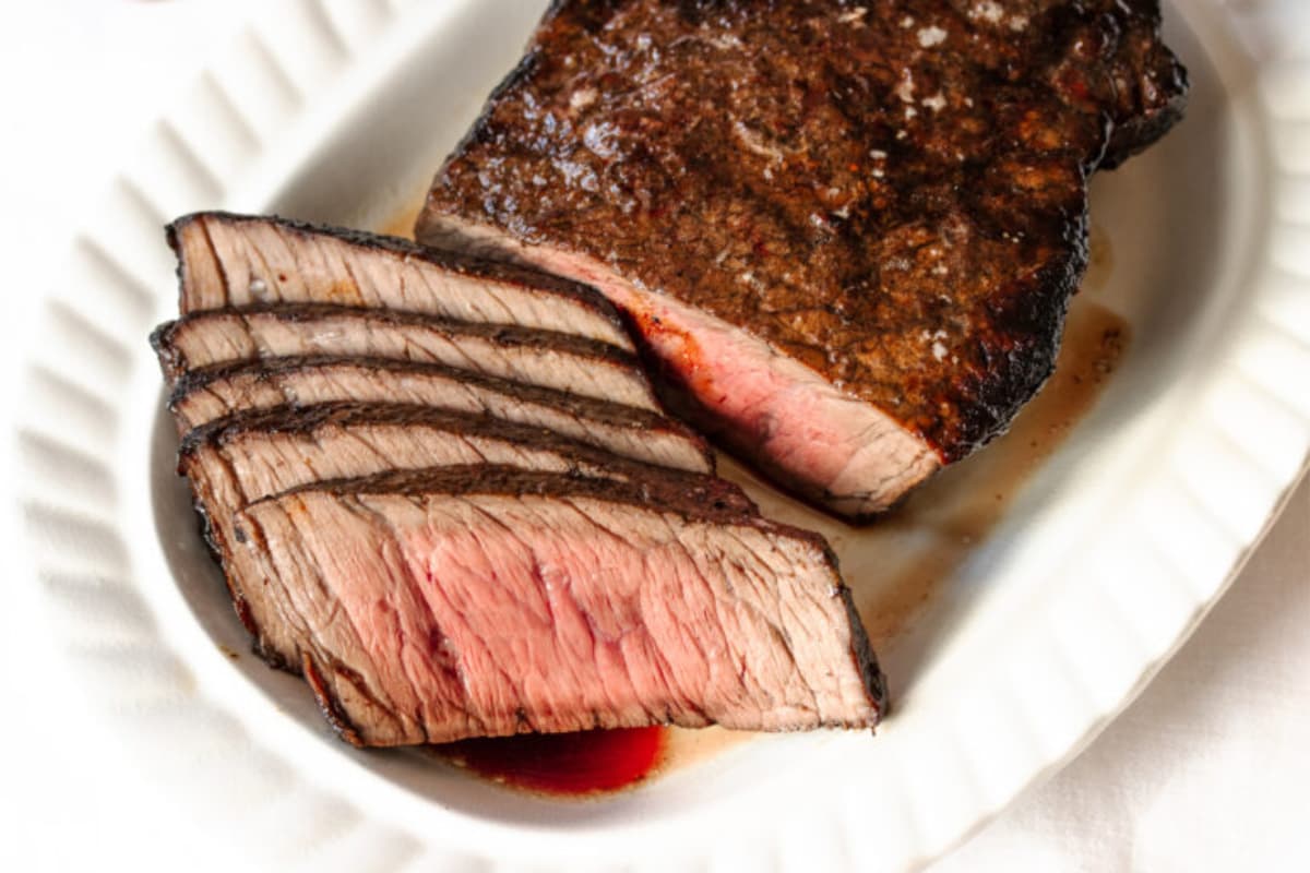 A dish of London Broil with Balsamic Glaze.