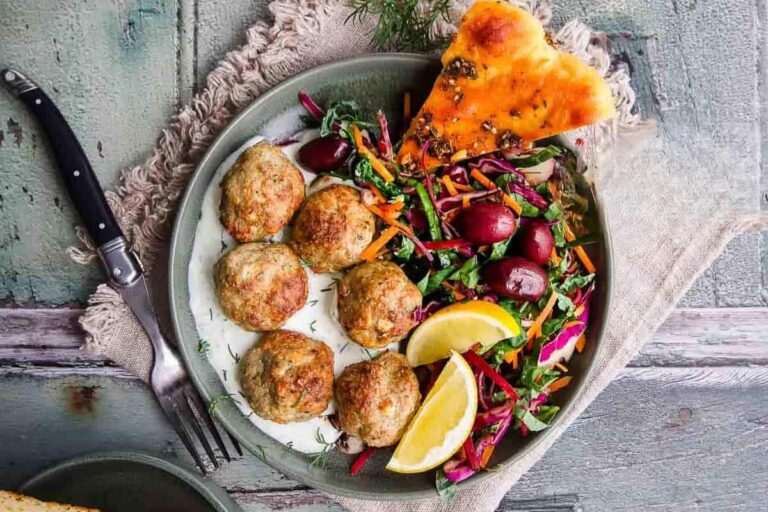A plate of Greek Turkey Meatballs and Yogurt Ranch Dressing.