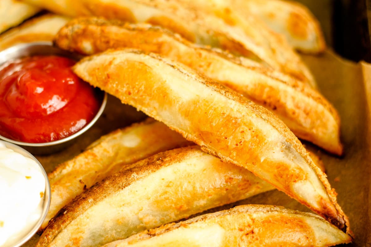 A tray of baked potato wedges.