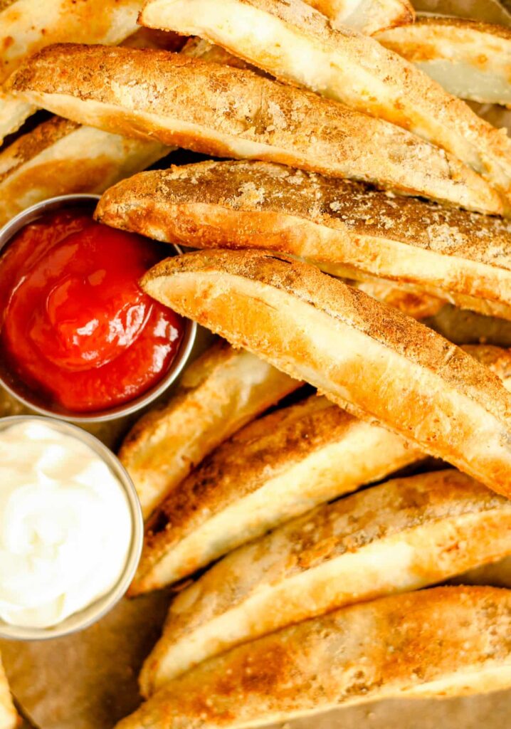 A tray of baked potato wedges.