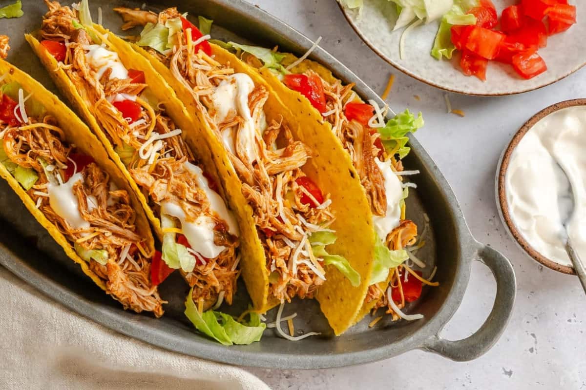 A dish of Easy 3 Ingredient Crock Pot Chicken Tacos.