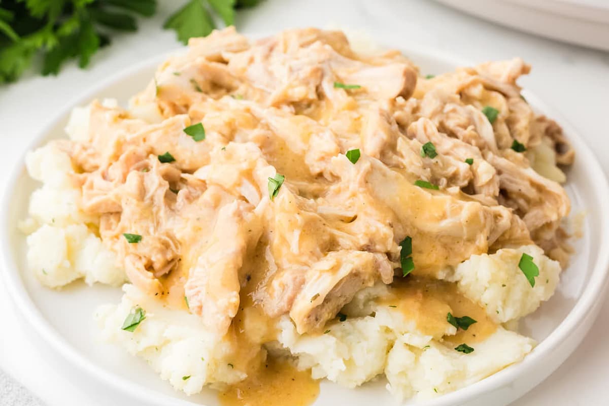 A plate of Crockpot Chicken and Gravy.