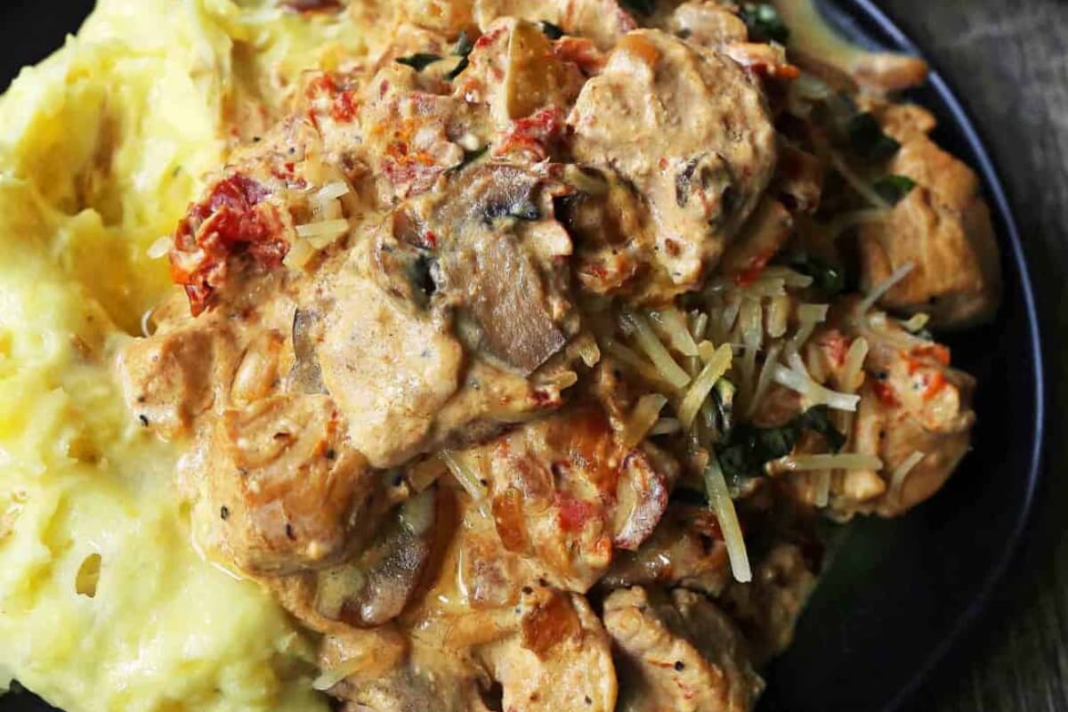 A plate of Slow Cooker Creamy Tuscan Chicken.