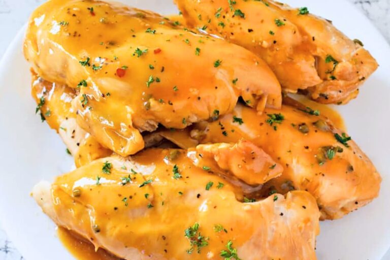 A plate of pineapple slow cooker chicken breasts.