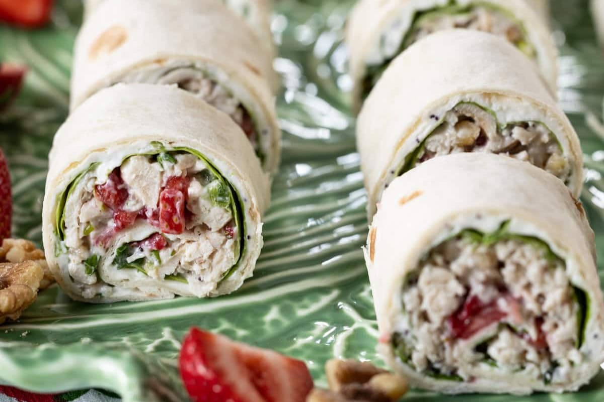 A plate of Strawberry Chicken Salad Sandwich Roll-Ups.