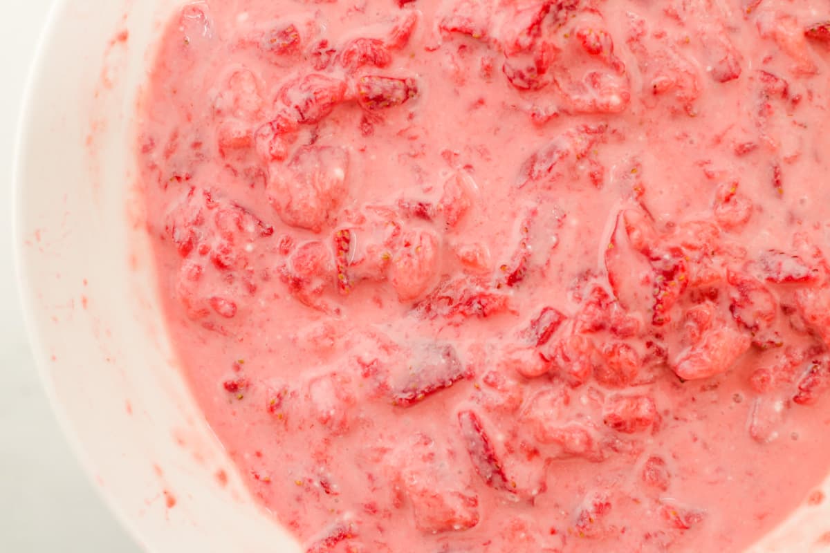 A bowl of strawberry sauce.