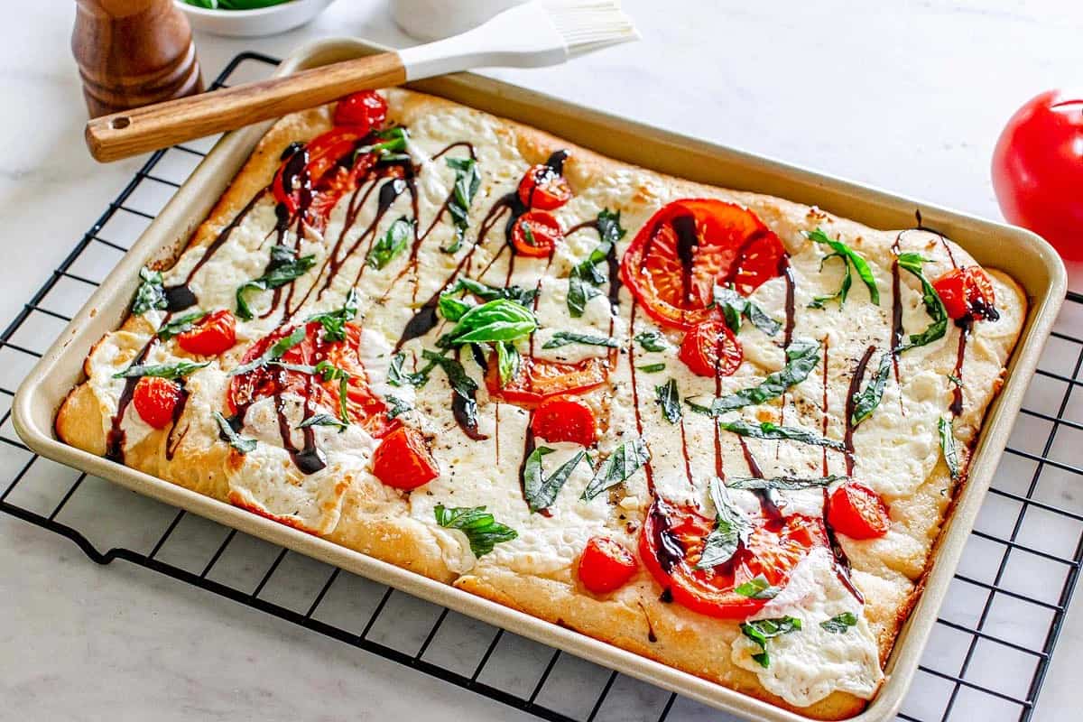 A dish of Sheet Pan Caprese Pizza.