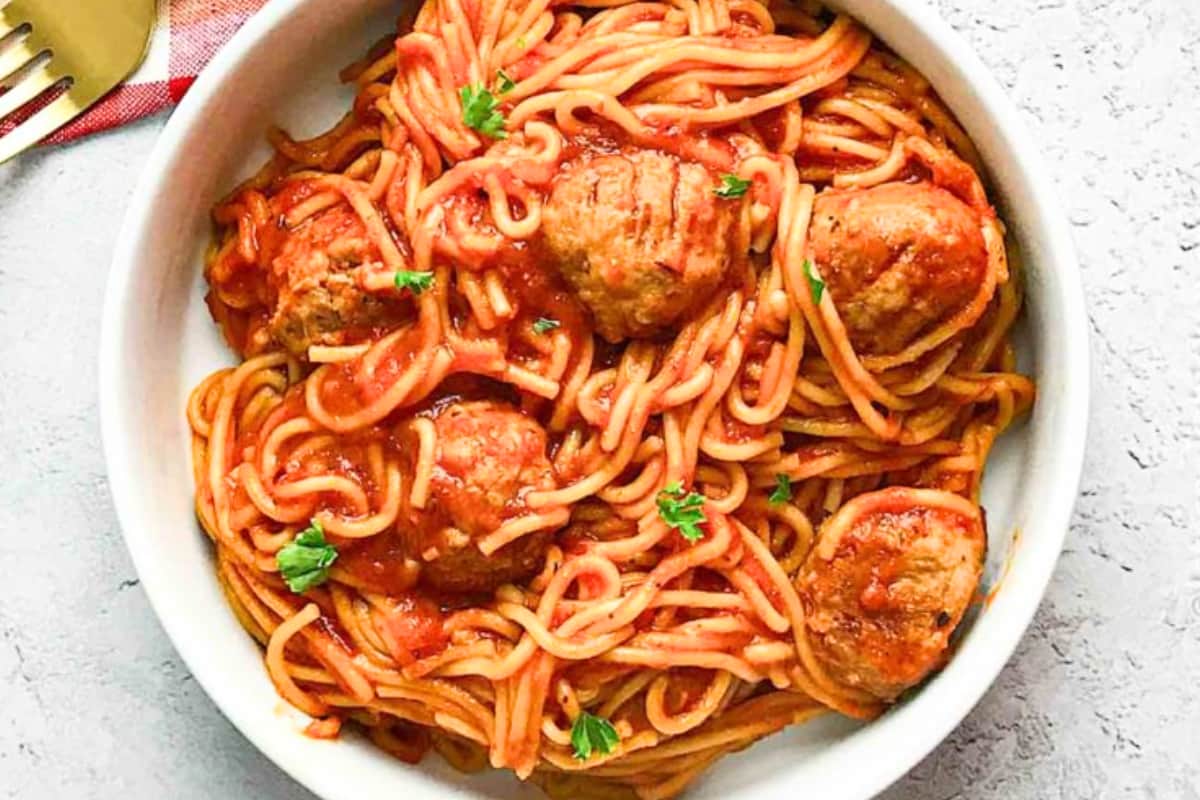 A dish of Instant Pot Spaghetti and Chicken Meatballs.