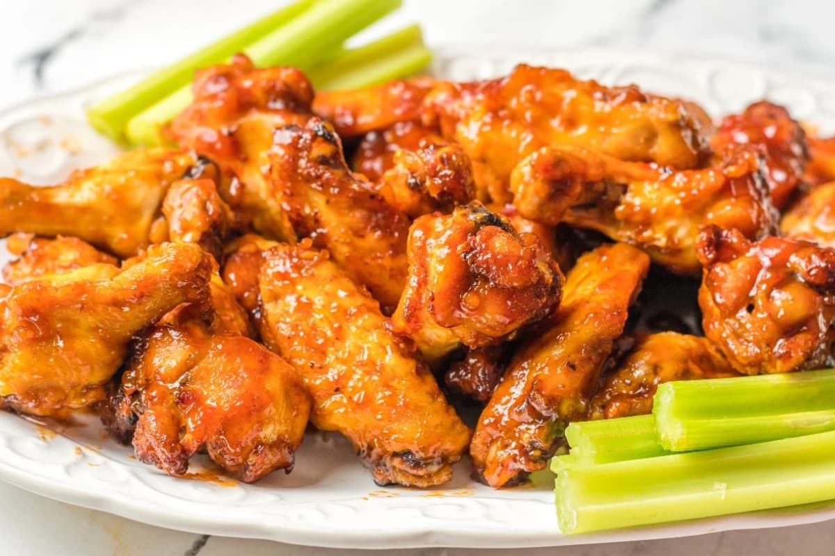 A plate of Air Fryer Peach-Bourbon Wings.
