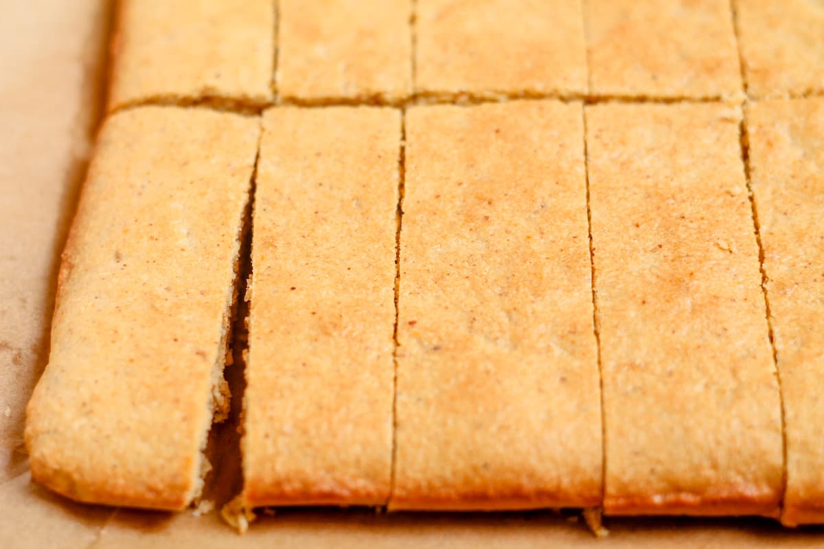 Soft baked protein bars sliced on a counter.