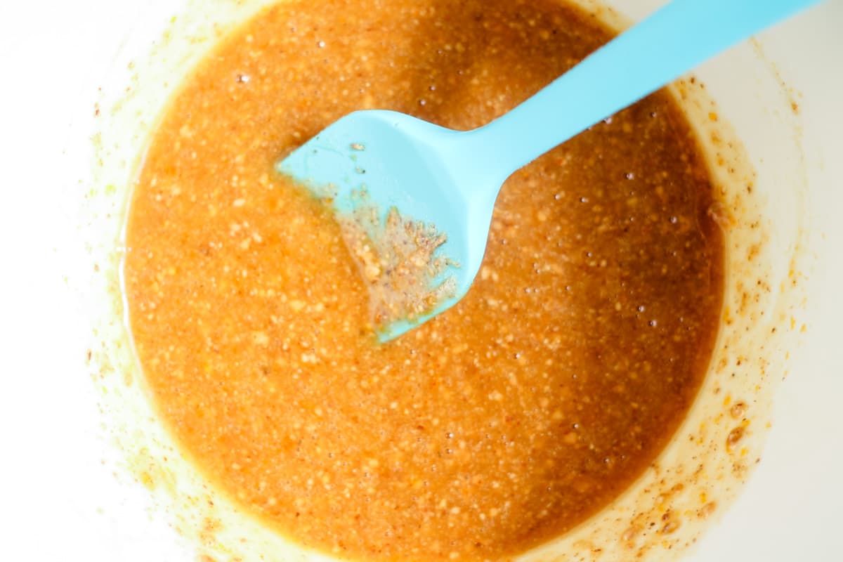 Ingredients being stirred in a bowl.