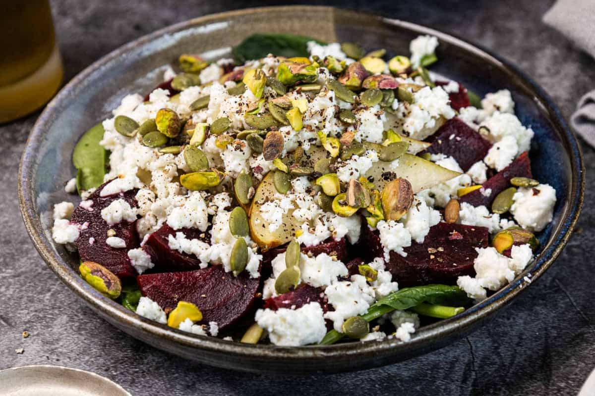 A dish of Beet and Feta Salad With Pistachios and Pears.