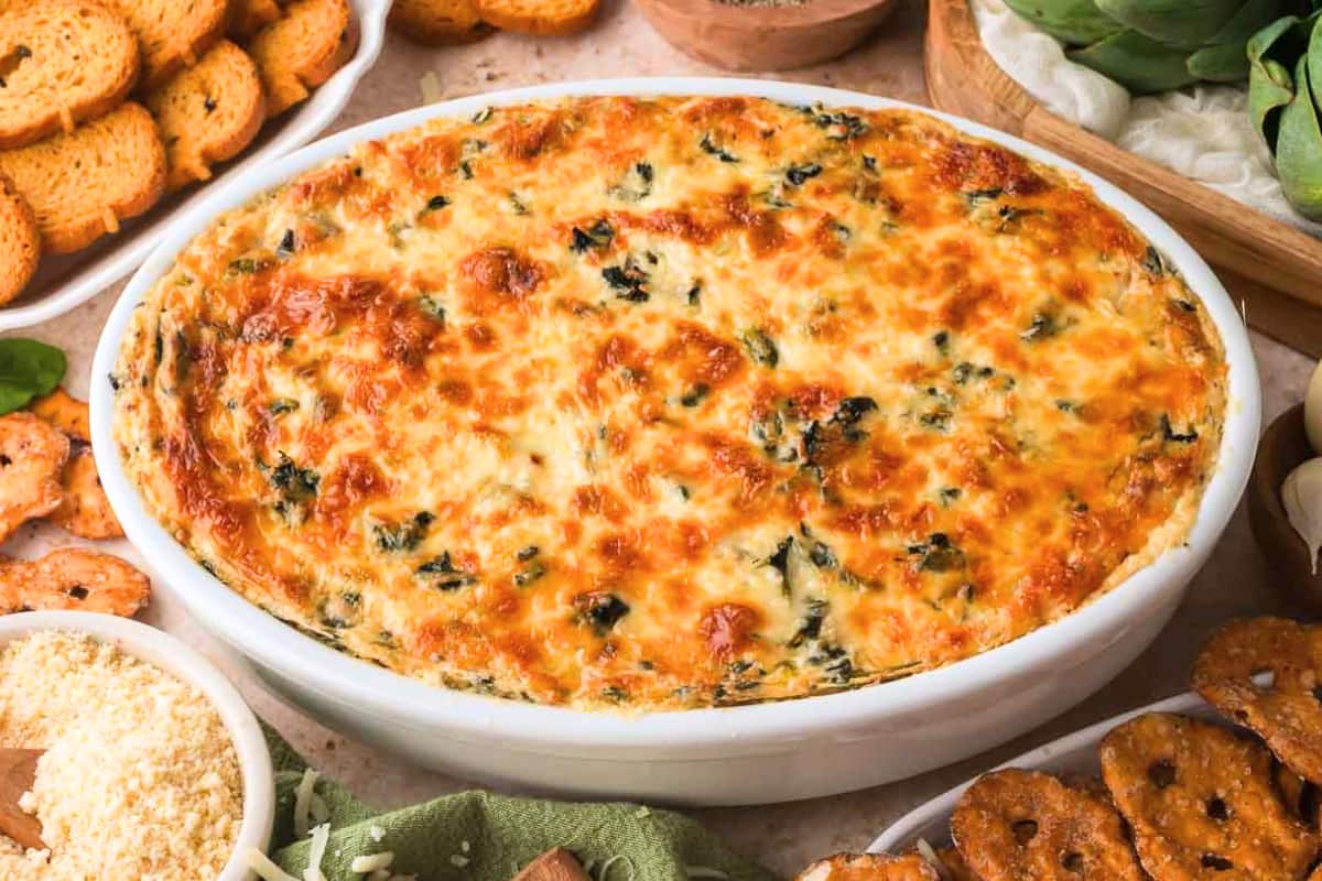 A dish of Baked Spinach Artichoke Dip.