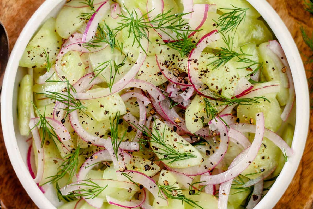 A dish of Cucumber Salad with Red Onion and Dill.