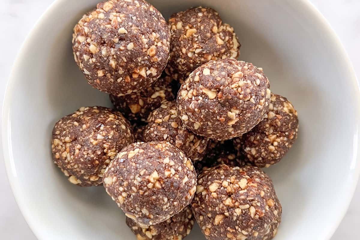 A dish of Chocolate Hazelnut Date Balls.
