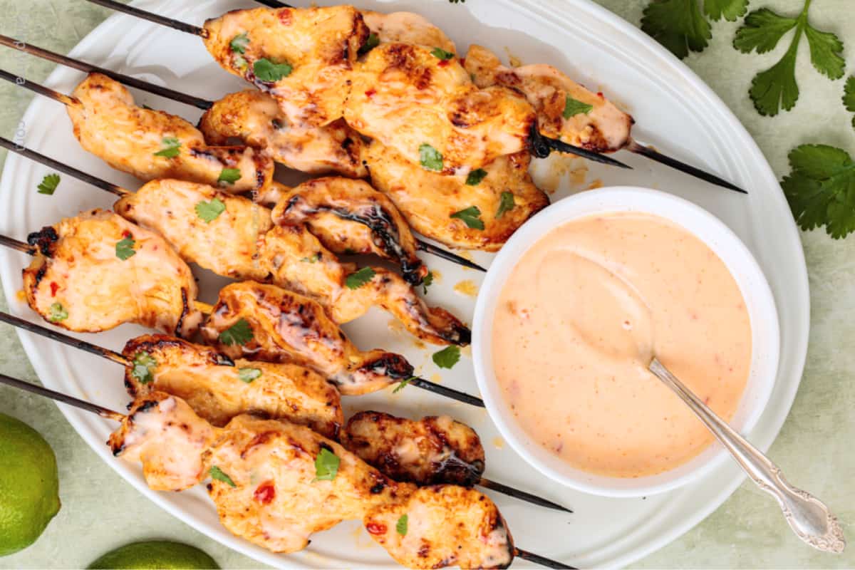A plate of Bang Bang Chicken Skewers.