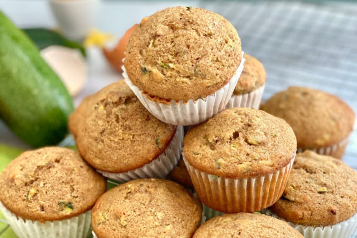 A plate of Moist Orange Zucchini Muffins.