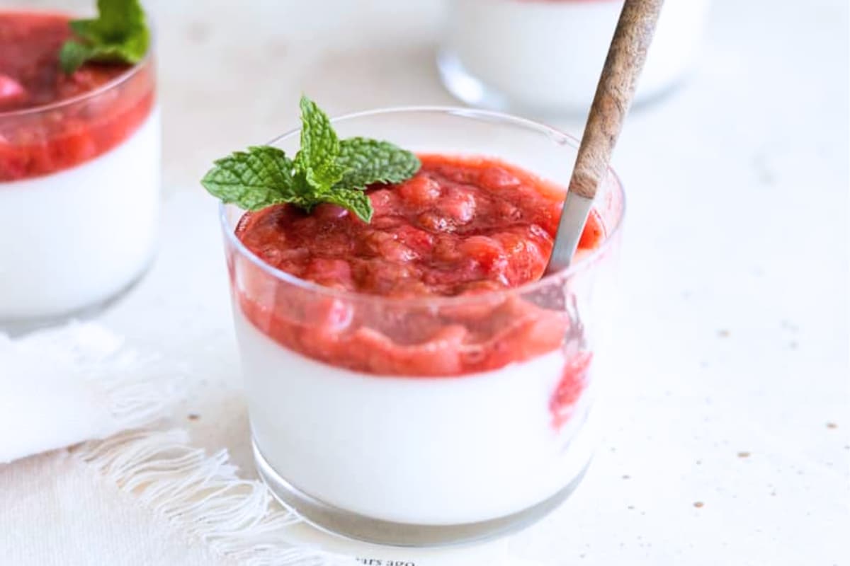 A dish of Panna Cotta with Strawberry Rhubarb Compote.