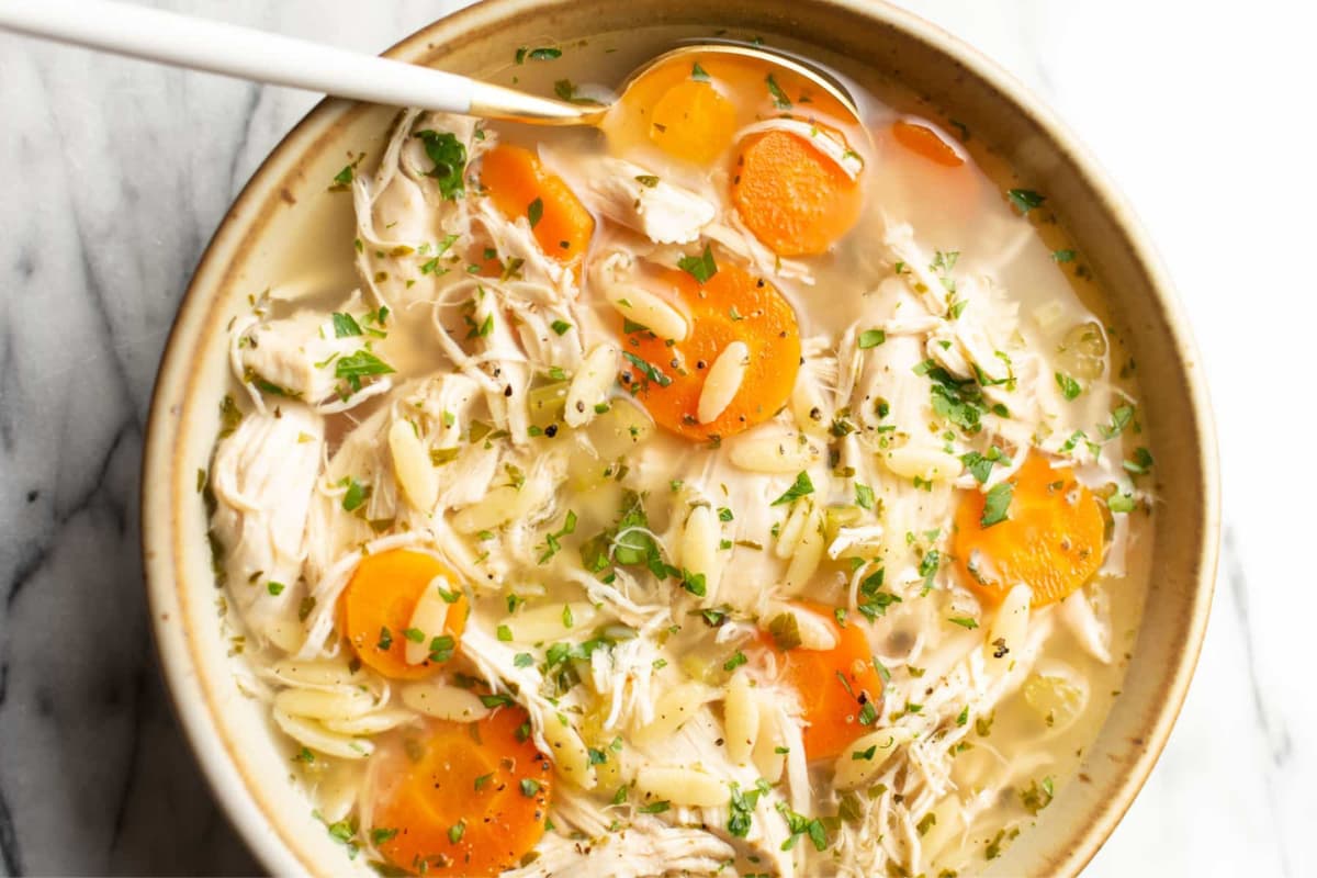 A dish of Crockpot Lemon Chicken Orzo Soup.
