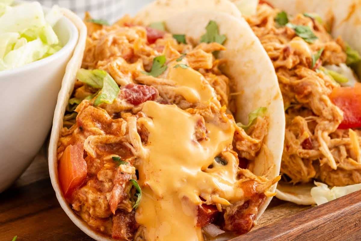 A plate of Slow Cooker Queso Chicken Tacos.