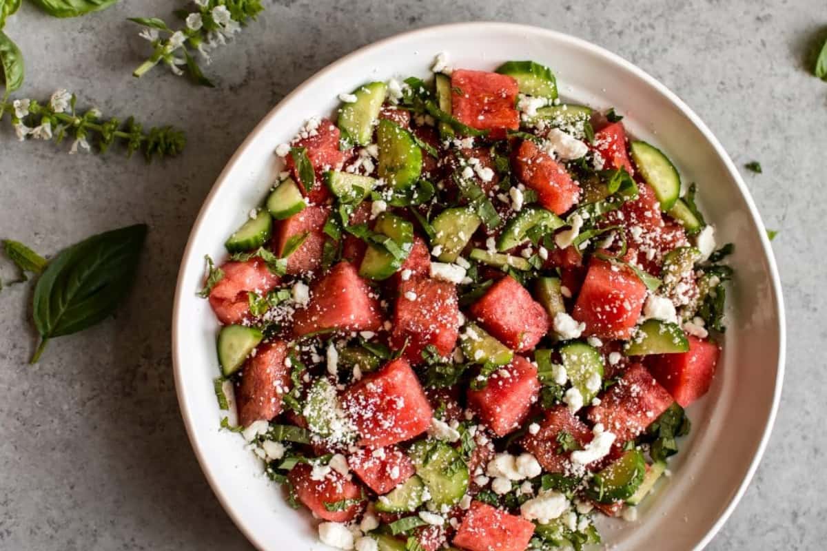 A dish of Watermelon Salad with Cucumber, Basil, and Mint.