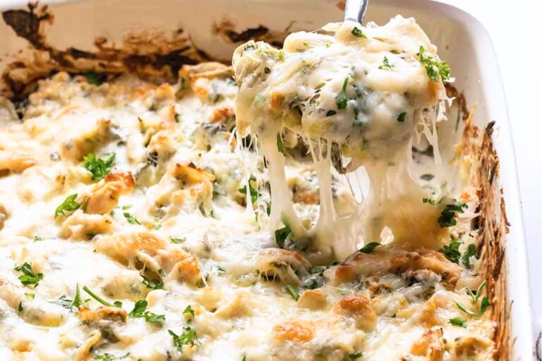 A dish of Creamy Spinach Artichoke Chicken Casserole.