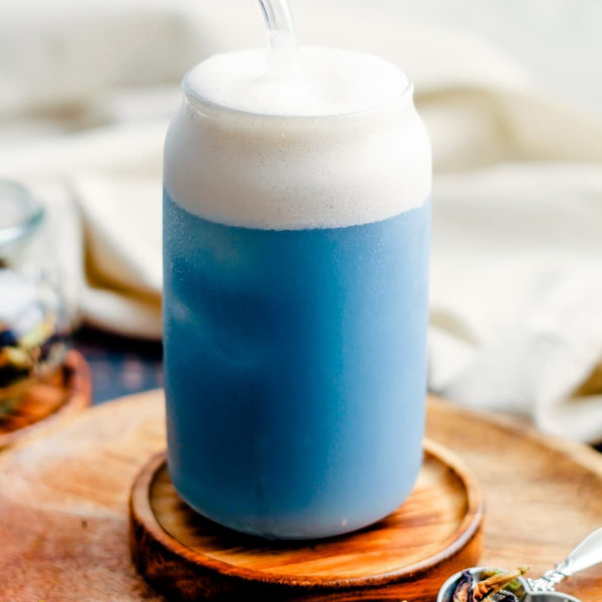A glass of butterfly pea latte.