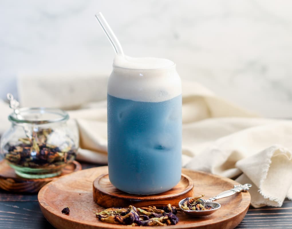 A glass of butterfly pea latte.