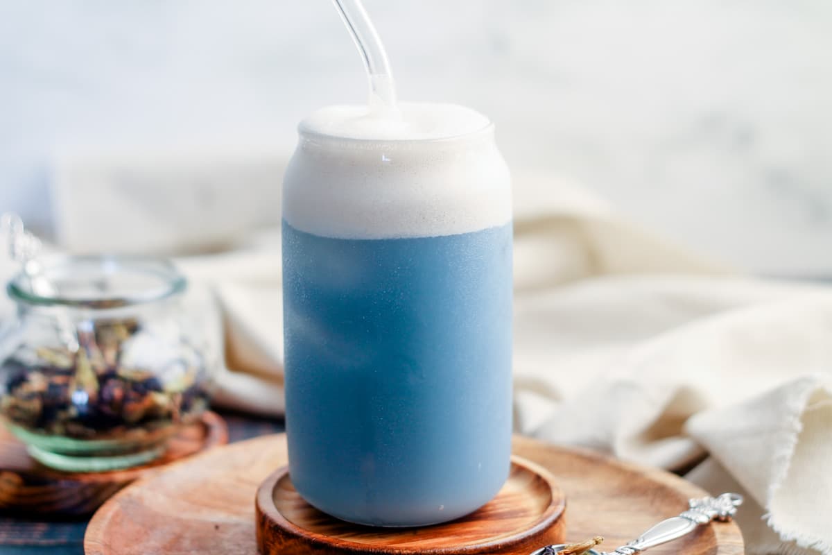 A glass of butterfly pea latte.