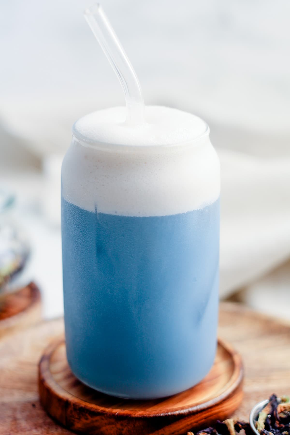 A glass of butterfly pea latte.