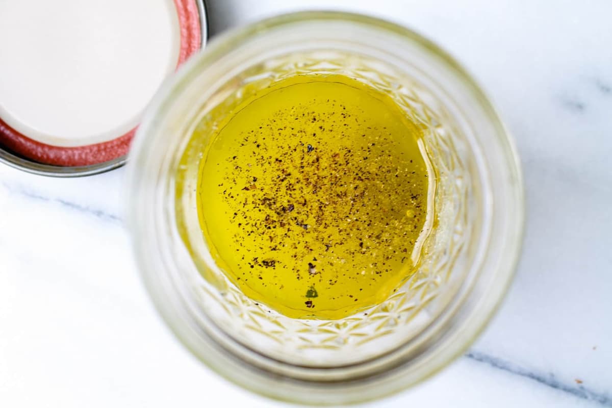 Salad dressing ingredients in a bowl.