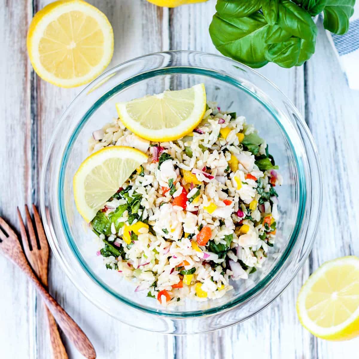 A bowl of chicken rice salad.