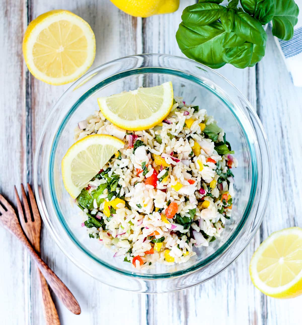 A bowl of chicken rice salad.