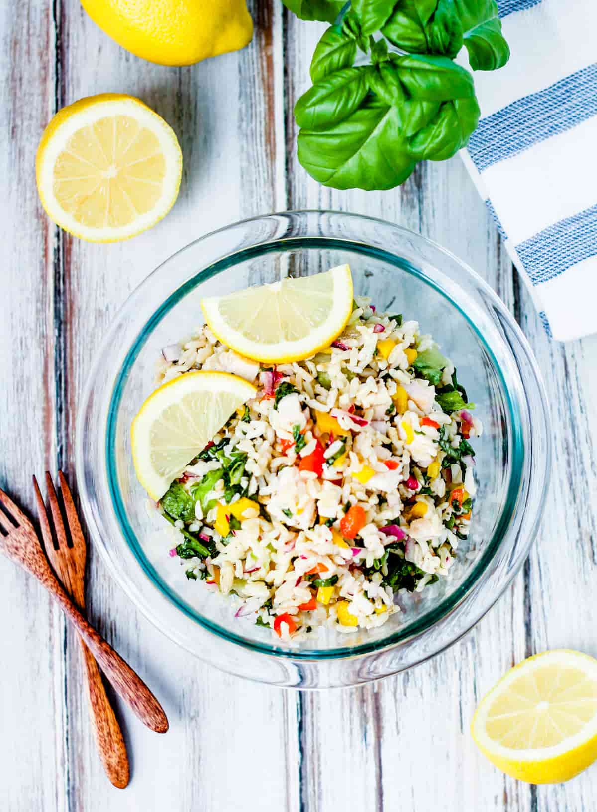 A bowl of chicken rice salad.