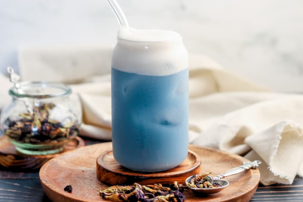 A glass of Butterfly Pea Iced Latte.
